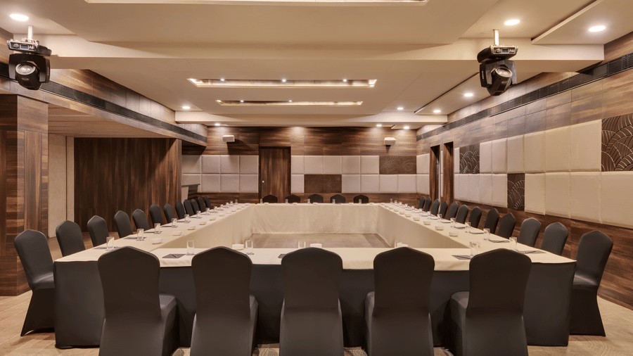 Spectrum Lounge at Voyage Milestone Hotel And Banquet featuring a U-shaped seating arrangement under warm lighting